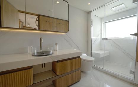 VIP ensuite aboard the Gulf Craft Majesty 145 with large shower, vanity unit and natural light