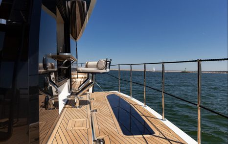 Starboard side deck aboard the Galeon 620 Fly showing the asymmetrical walkway design.