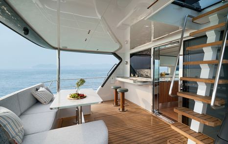 CL Yachts CLB65 SUV Motor Yacht aft deck with U-shaped sofa 