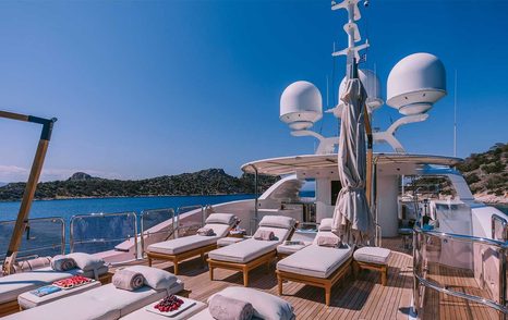 Superyacht IDyllic sudneck with sun loungers  