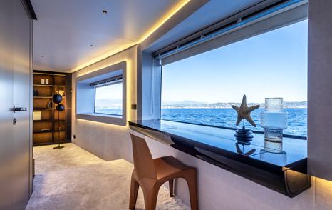 Motor yacht Arcadia A96 desk and window over looking the sea 