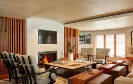 Amels expedition yacht Just B saloon with fireplace 