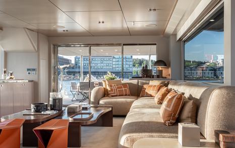 Numarine 27XP Explorer Yacht Maske main saloon L-shaped white sofa and glass sliding doors 