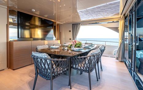 Motor yacht Speranza II's main saloon dining table