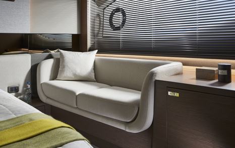 Princess V55 owner’s cabin seating area beneath hull window in twin shaft-drive sportsboat