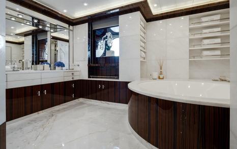AHS owners en suite with marble and wood detailing 