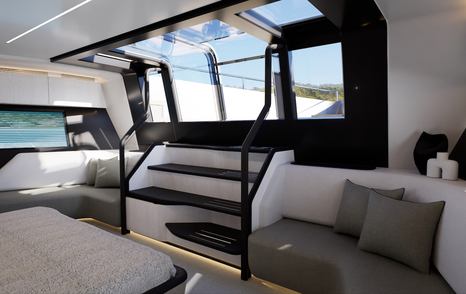 Interior of the master cabin on Pearl 100 Hybrid motor yacht with skylight, seating area, and stair access