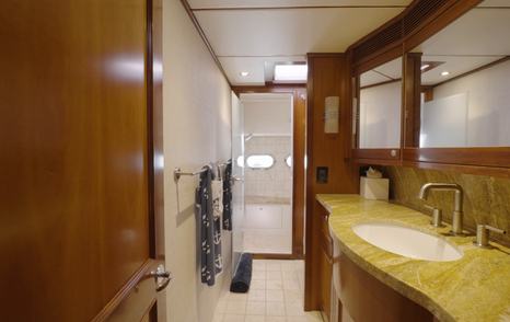 Nordhavn 75 EYF owner's ensuite with granite vanity, walk-through layout and separate shower