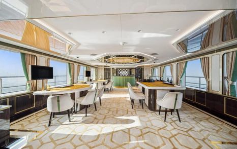 superyacht bombay main saloon with casino table