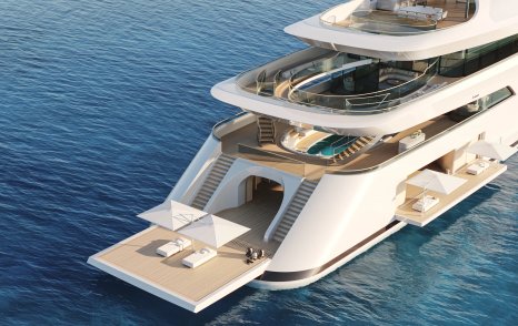 Overview of Feadship PURE beach club, transom folded down to water level with sunloungers and parasols.