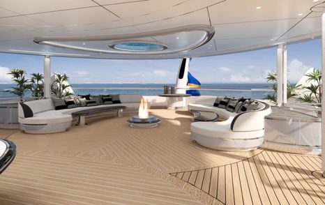 Superyacht Kismet aft deck with shaded curved seating and firepit 
