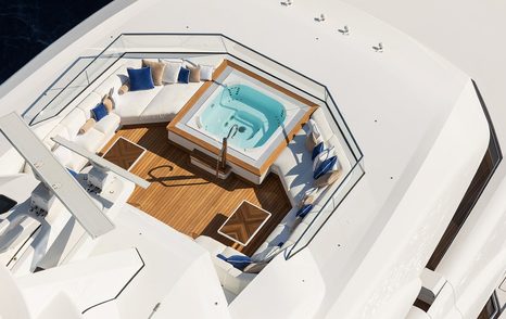 Sun deck onboard superyacht MADSUMMER, on deck Jacuzzi surrounded by plush seating. 