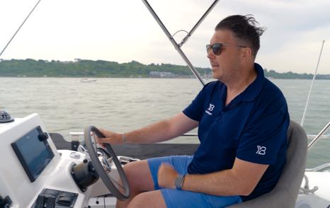 Beneteau Swift Trawler 37 Fly Jack Haines at flybridge helm during sea trial