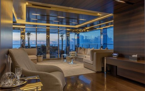 Superyacht Safe Haven main saloon with large glass sliding doors 