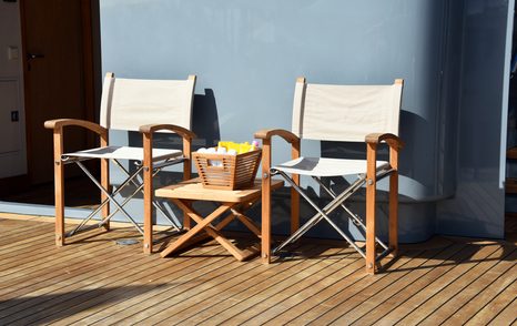 two directors chairs on yacht transom in sunshine