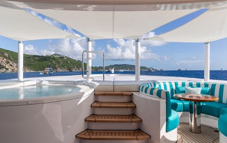 Foredeck on Superyacht Asia's owner deck with jacuzzi and circular seating