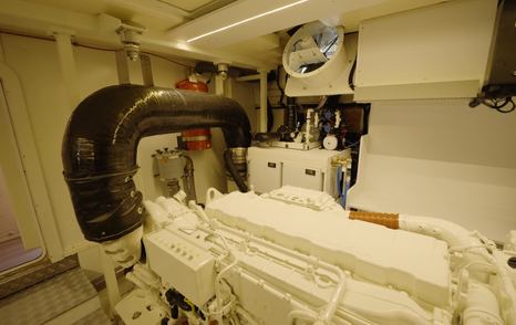 Beneteau Grand Trawler 63 engine room with neatly installed systems and wide service access around the engines