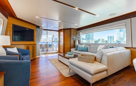 Motor Yacht Q main saloon with mounted TV