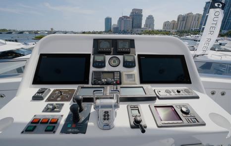 Nordhavn 75 EYF flybridge helm console with navigation displays, engine controls and docking controls
