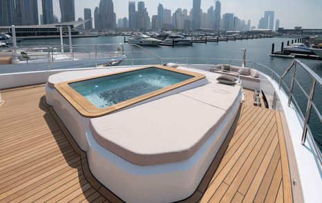 On-deck Jacuzzi onboard the Majesty 111, located on the bow with views over Dubai Harbour.