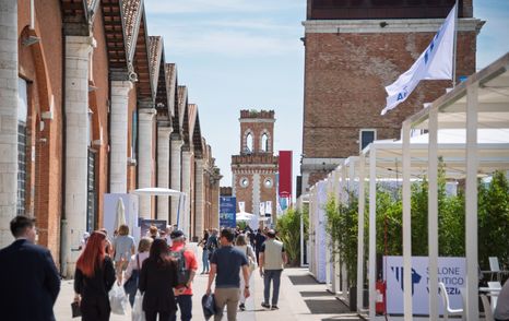 Visitors walking through the Venice Arsenale
