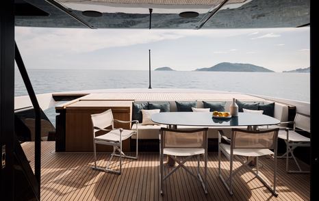 Bluegame BGX83 motor yacht aft deck dining area 