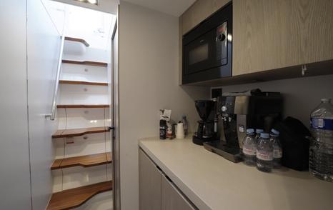 Pearl 73 crew galley with side-deck access stairs