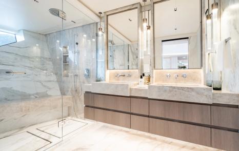 Superyacht M's ensuite bathroom with twin basin, shower and marble detailing 