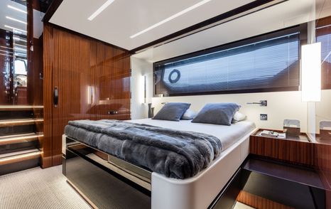 Double bed in wooden detailed cabin on 56' Rivale Hard Top