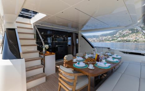 Ferretti yacht Alegria II aft deck dining area 