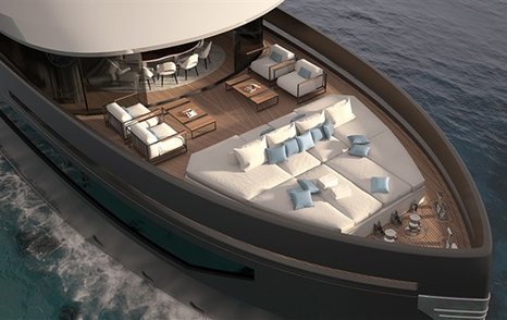 raised area of white sun pads and four white armchairs facing each other on the foredeck of the B.YOND 37M