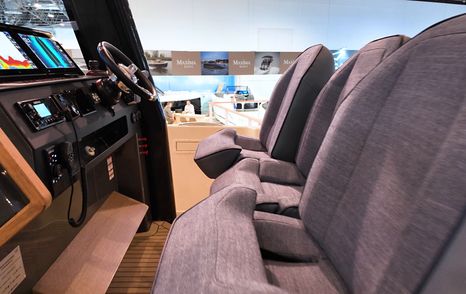 Twin helm seats on the Aiata Sunfinder 50 positioned behind the main console inside the wheelhouse.