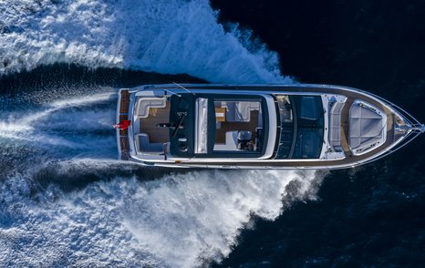 Aerial view of Pearl 62 flybridge yacht underway, surrounded by sea