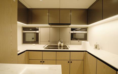 Sunreef Ultima 88 lower galley with hob, ovens and overhead storage