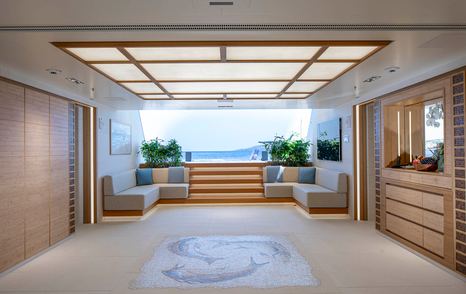 Lürssen Superyacht Hadar pre-refit beach club with L-shaped seating 