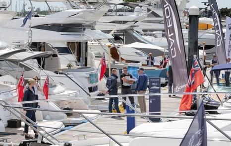 Swanwick Marina during boat show with flags and visitors