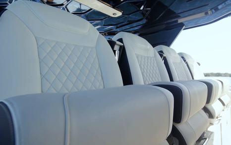 Aquila 45 Sport helm seating with four forward-facing chairs and bolsters, showing social driving layout