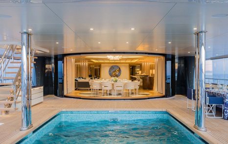 Superyacht Here Comes The Sun aft pool with dining area