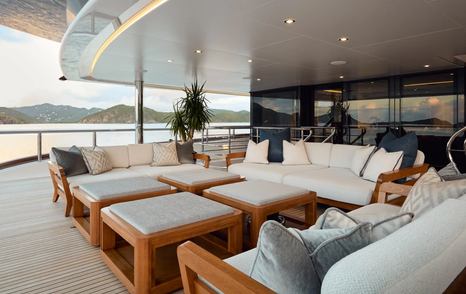 Superyacht Vanish main aft deck with shaded cushioned seating