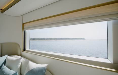Panoramic hull window in the Gulf Craft Majesty 100 Terrace owner's cabin