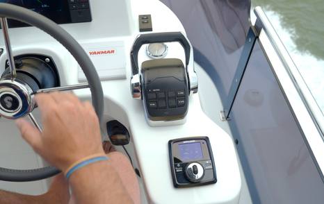 Yanmar throttle controls and Zipwake trim controller at the flybridge helm