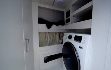 Manda S07 Berlinetta crew cabin showing integrated washer dryer and storage space