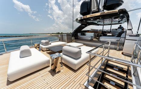 Motor yacht Chop Chop's upper deck with sunpads and hardtop