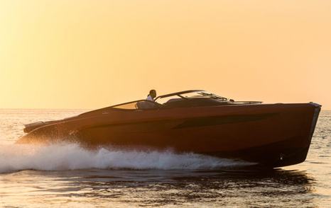 Sideview of Princess R35 underway at sunset, surrounded by sea