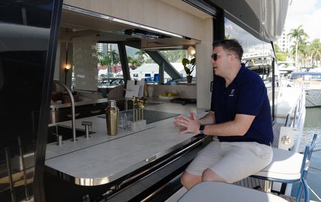 Fold-out waterside bar terrace aboard the Galeon 620 Fly with opening galley window.