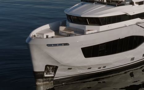 Numarine 40MXP steel explorer yacht bow showing plumb stem and expansive superstructure glazing