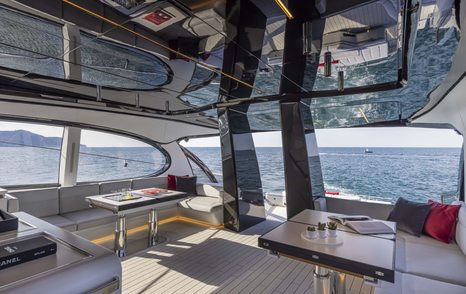 Interior of superyacht ALDABRA with seating and tables visible