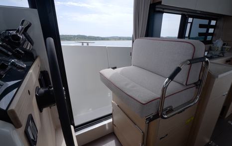 Helm seat with fold-down footrest on the Beneteau Swift Trawler 37 Fly