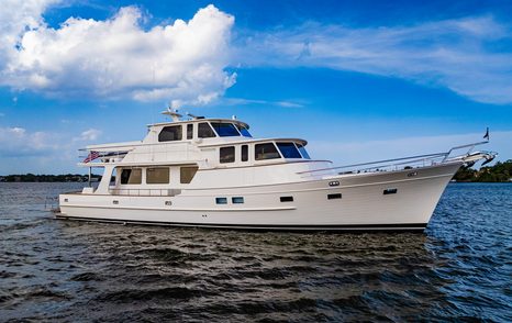 Fleming 85 enclosed flybridge yacht profile with raised pilothouse and additional upper-deck living space