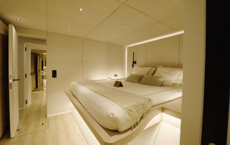 Sunreef Ultima 88 double guest cabin with raised bed and integrated lighting